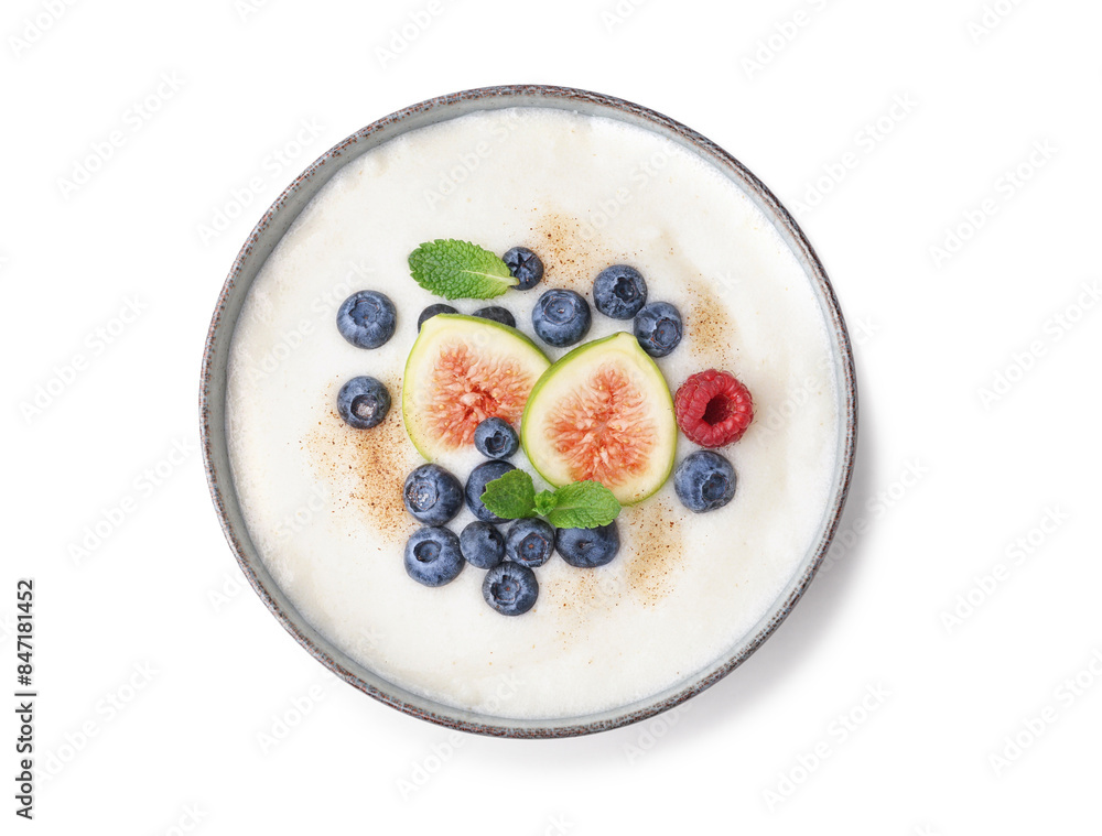 Bowl of tasty semolina porridge with fresh berries and figs on white background Bowl of tasty semolina porridge with fresh berries and figs on white background
