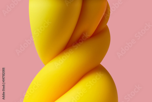 Yellow matter deformed into spring on pink studio background