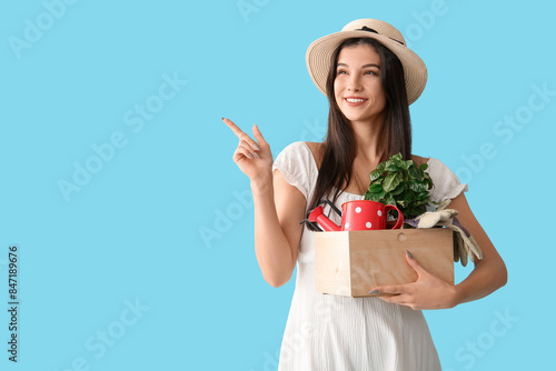 Young happy female gardener...
