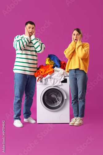 Shocked young couple doing ...