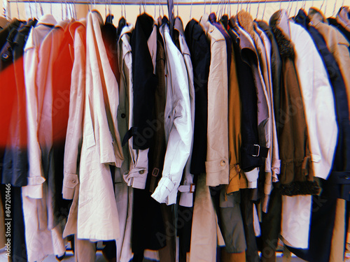 Variety of vintage coats on a flea market photo