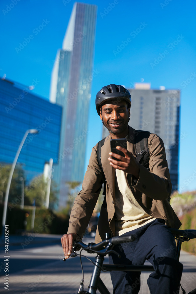 Man with bicycle and smartphone on city street Man with bicycle and smartphone on city street
