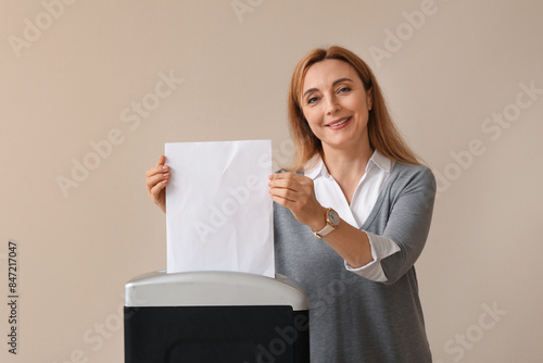 Adult woman destroying pape...
