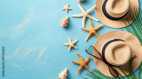 Summer Beach Essentials with Straw Hats, Starfish, and Shells on Blue Background
 photo
