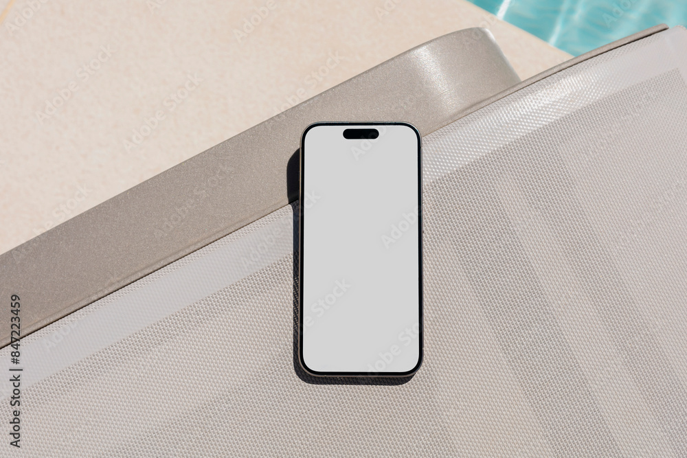 © Artem Podrez/Stocksy - Mockup Smartphone with white screen at Sunny Poolside