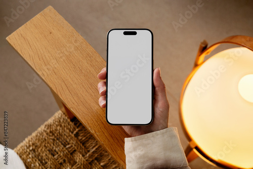 Mockup Smartphone with white screen in cozy home