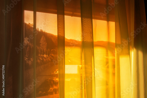 Window curtain in sunlight photo