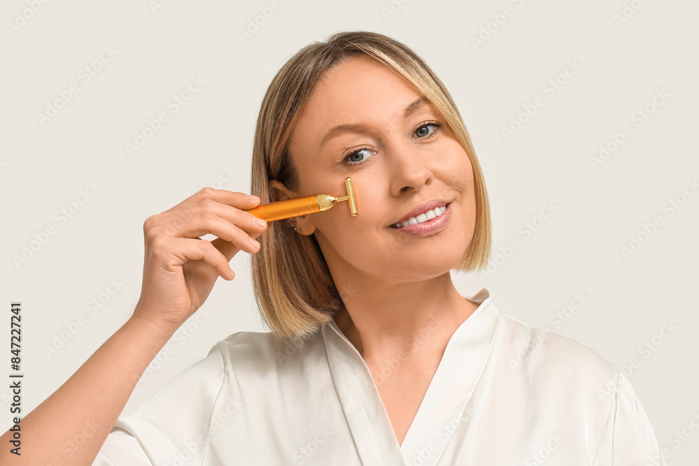 Woman with massage roller on white background Woman with massage roller on white background