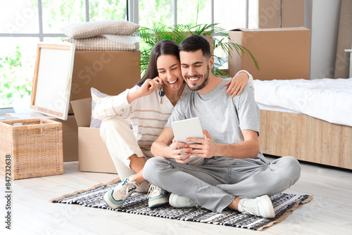 Young couple with keys and ...