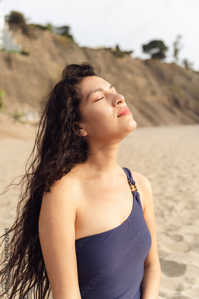 Woman Enjoying Breeze on Sandy Beach Woman Enjoying Breeze on Sandy Beach