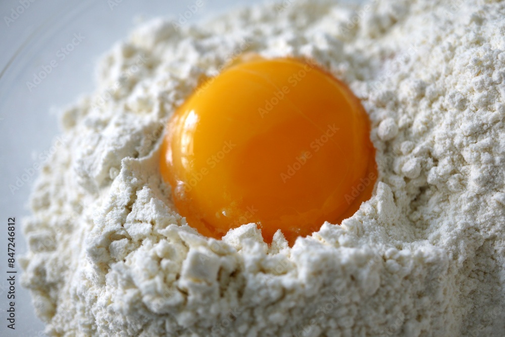 egg flour on white background close up - baking ingredients egg yolk for bread or cake egg flour on white background close up - baking ingredients egg yolk for bread or cake