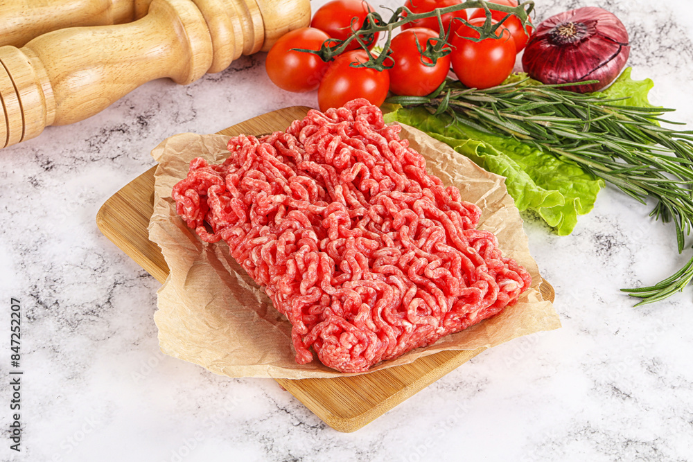 Raw minced beef meat on cutting board Raw minced beef meat on cutting board