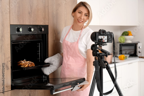 Female food blogger baking ...
