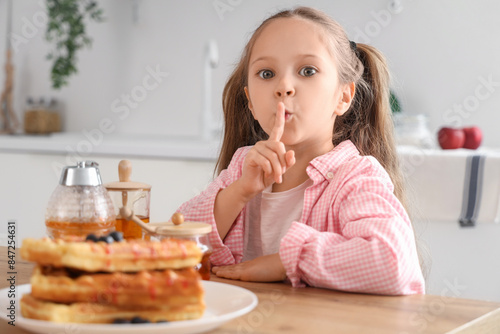 Cute little girl with honey...