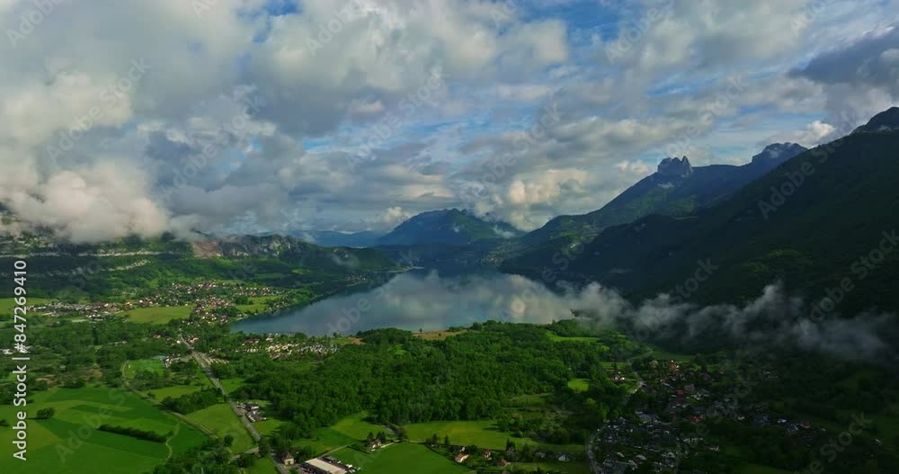 Mountain cloud top view landscape. Beautiful nature France natural landscape. View of lake Annecy. Panoramic view of Mountains that surrounds lake Annecy Mountain cloud top view landscape. Beautiful nature France natural landscape. View of lake Annecy. Panoramic view of Mountains that surrounds lake Annecy