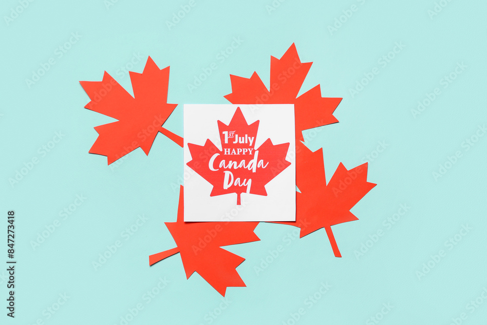 Greeting card and Maple leaves on cyan background. Canada Day concept Greeting card and Maple leaves on cyan background. Canada Day concept