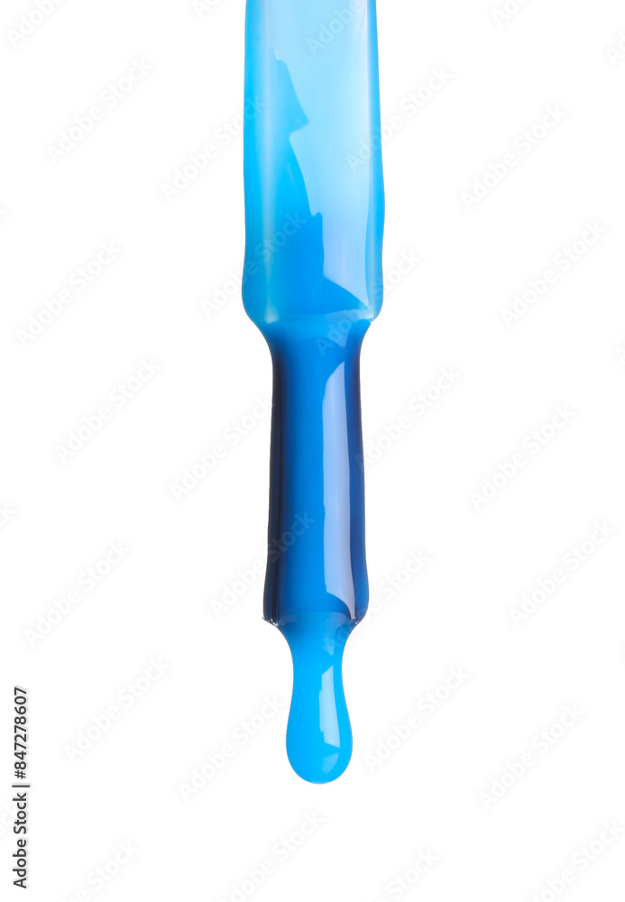 Blue nail polish dripping from brush isolated on white Blue nail polish dripping from brush isolated on white