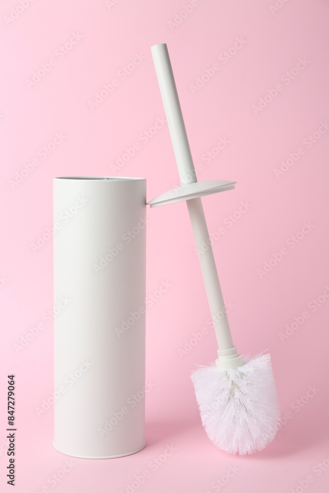 Toilet brush and holder on pink background Toilet brush and holder on pink background