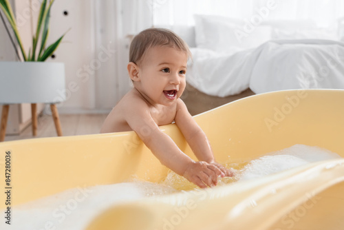 Cute little baby with water...