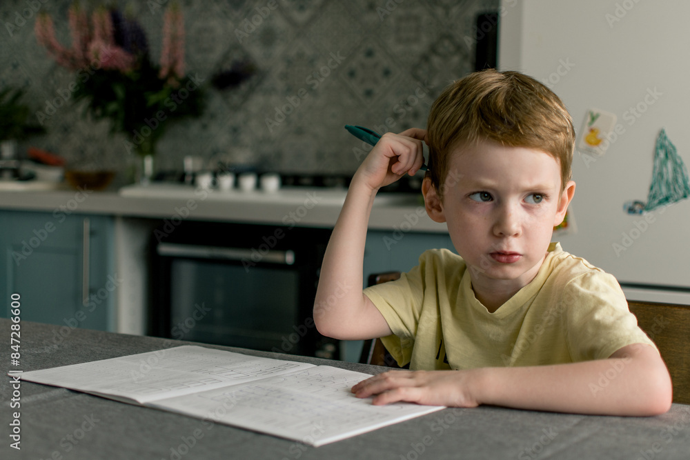 School girl going homework at home, writing in notebook. School girl going homework at home, writing in notebook.