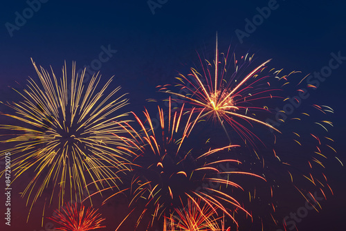 Colorful fireworks on night sky background.
