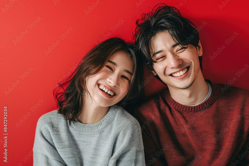 Happy East Asian Couple isolated on a red Background China Japan Korea Smiling Embracing Love Joyful Cheerful Portrait Studio Photography Relationship Togetherness Happy East Asian Couple isolated on a red Background China Japan Korea Smiling Embracing Love Joyful Cheerful Portrait Studio Photography Relationship Togetherness