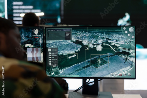 Canvas Print Recruit analyzes satellite radar CCTV footage in control room, monitoring the infantry unit during a battle