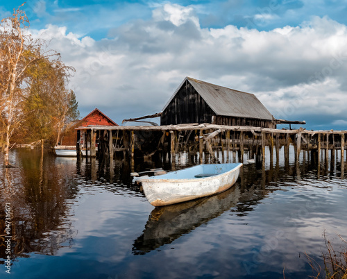 skiff floating peacefully, undisturbed photo