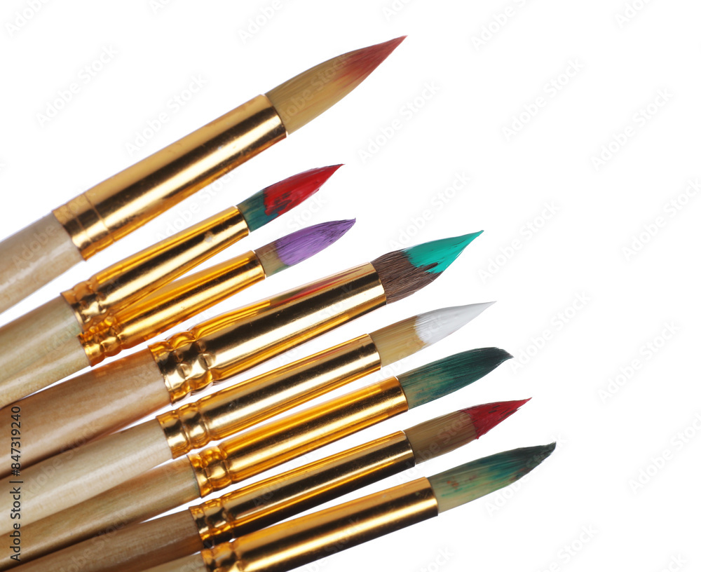 Wooden brushes with colorful paints isolated on white Wooden brushes with colorful paints isolated on white