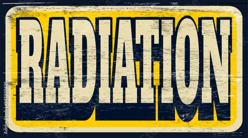 Aged and worn radiation sign on wood