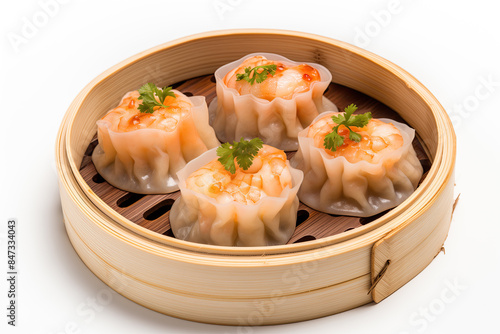 A close-up view of tasty steamed dumplings dim sum garnished with fresh coriander leaves, served in a traditional bamboo steamer against a white background.