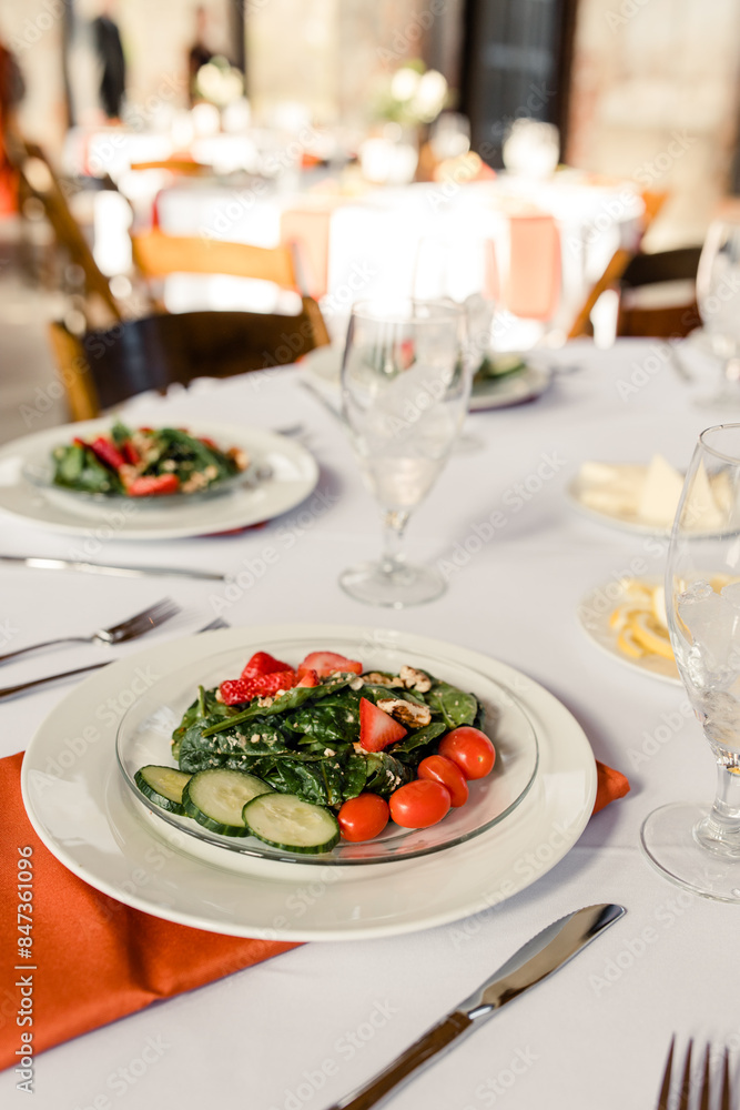 Salad plate with strawberries, cucumbers, tomatoes on table setting
Salad plate with strawberries, cucumbers, tomatoes on table setting