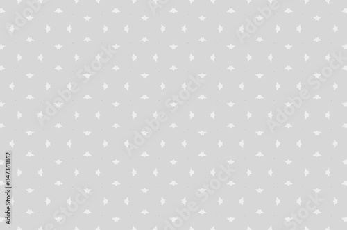 A pattern of white dots on a gray background