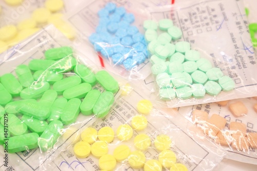 colourful pills on a white background photo