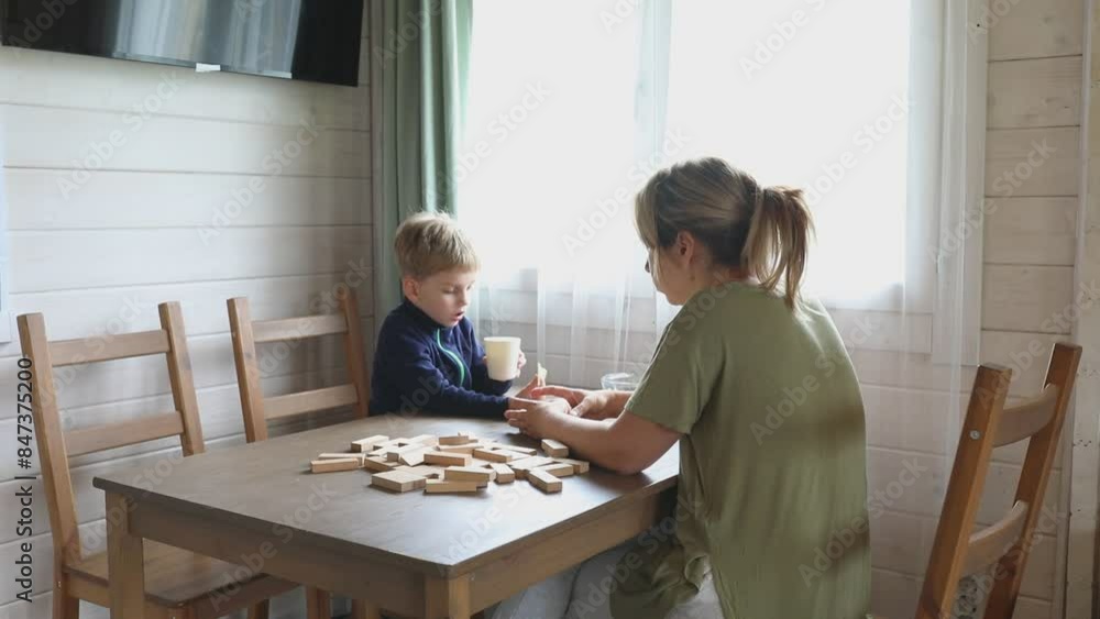 Mother and Son Play Jenga Board Game at Home Mother and Son Play Jenga Board Game at Home