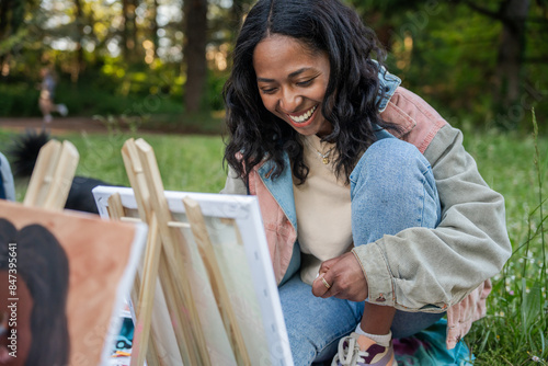 Girl Painting Outdoors.  photo