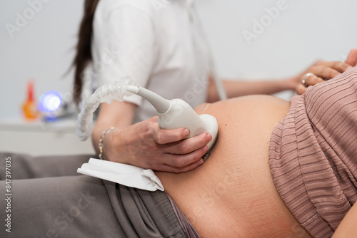 Close-up of a prenatal check-up with a doctor 