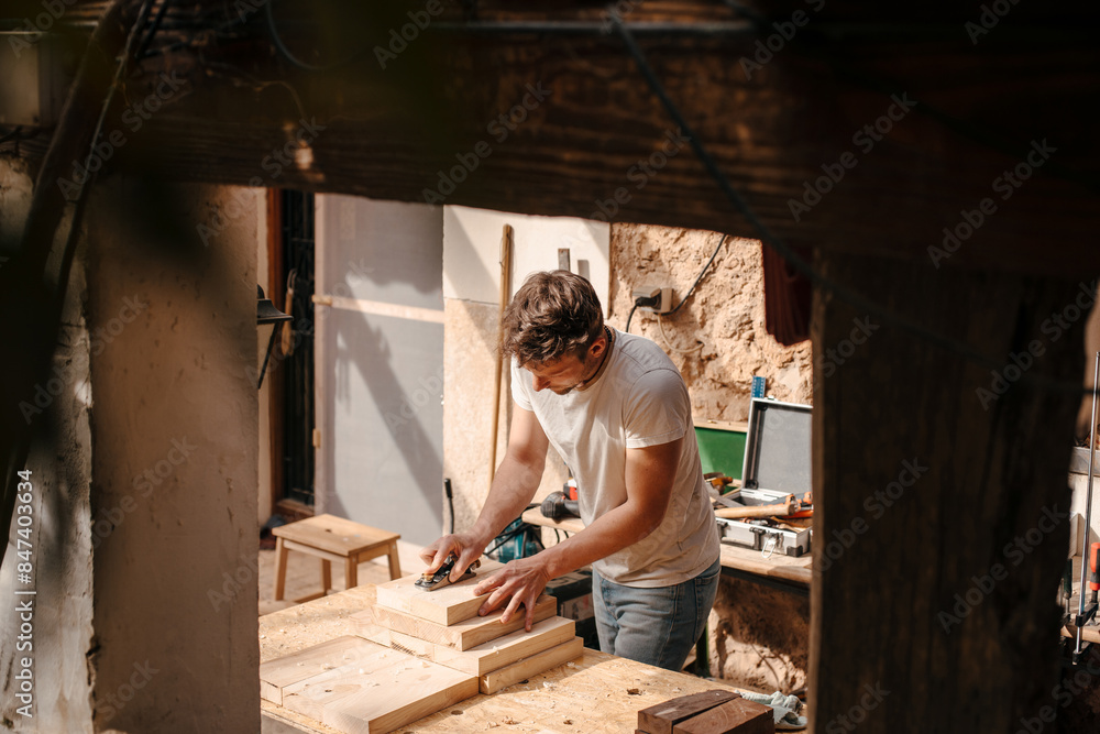 Carpenter working at his workshop
