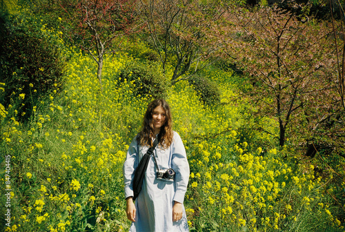 Portrait of young woman in yellow field photo