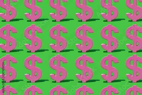 pattern of pink dollar signs on a green background