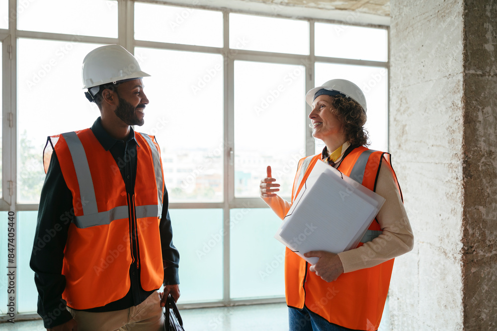 Architects examining building site Architects examining building site