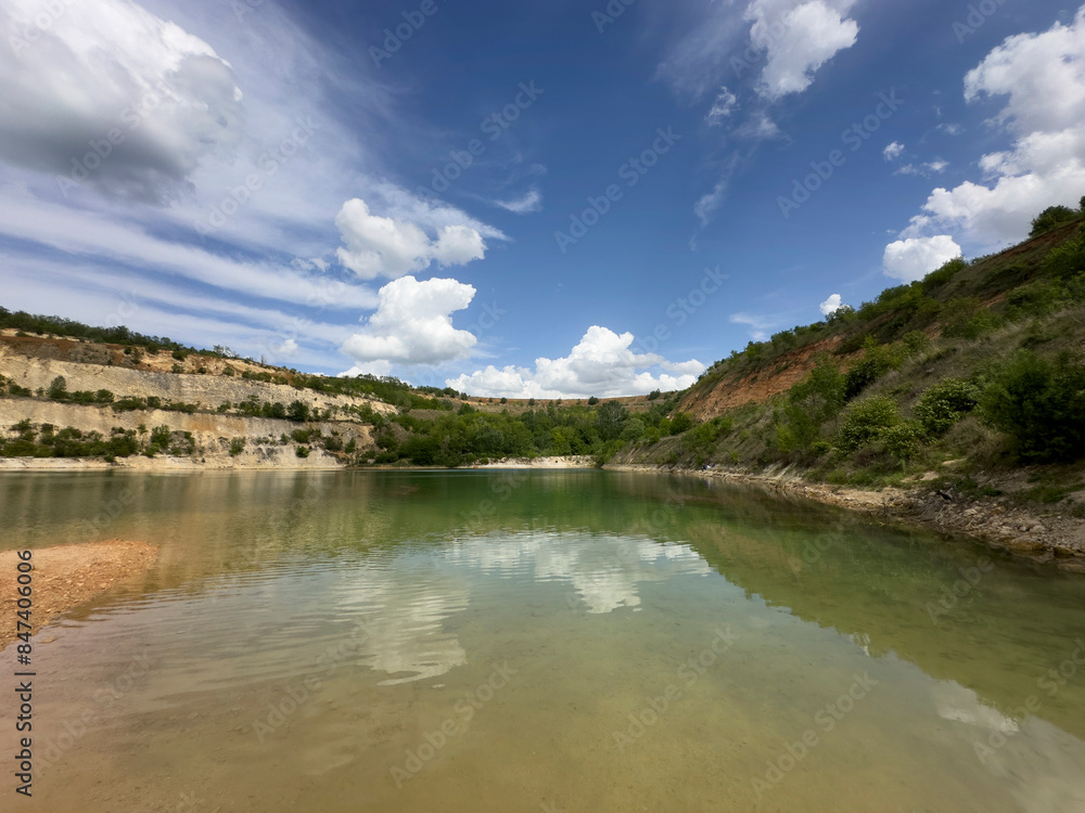 Green lake in nature and blue sky Green lake in nature and blue sky