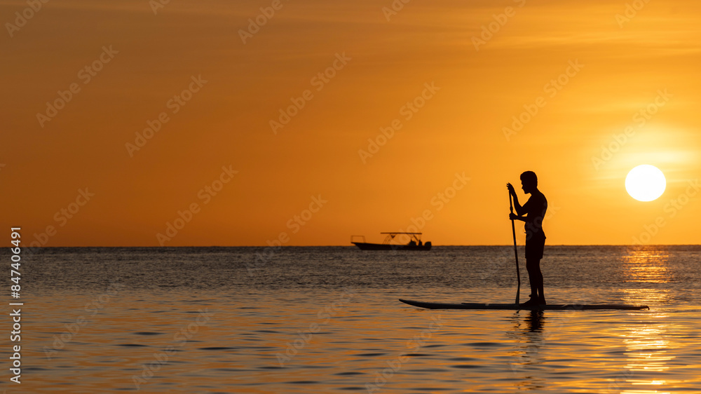 Sunset over Boracay with Silhouette of a SUP Sunset over Boracay with Silhouette of a SUP