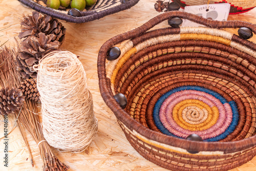 Photography overhead view of a still life with a colorful handmade basket made of fique
