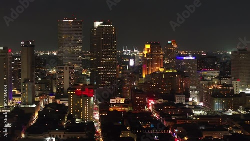 Wallpaper Mural Aerial view of downtown New Orleans at night, showcasing the vibrant cityscape with glowing lights, office buildings and and bustling streets Torontodigital.ca