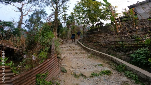 Indian Travelers Exploring Mountain Village Near Buxa Fort photo