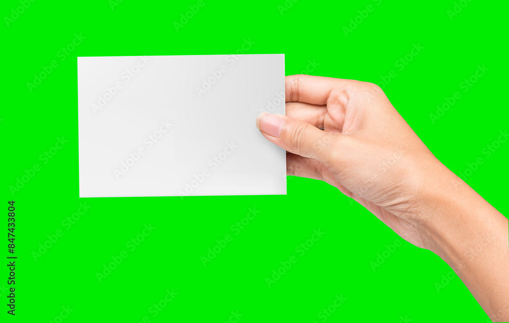Hand holding blank card on greenscreen background Hand holding blank card on greenscreen background