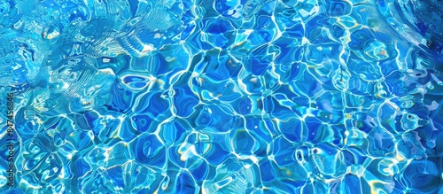 The vibrant blue water shimmers on the surface of the pool