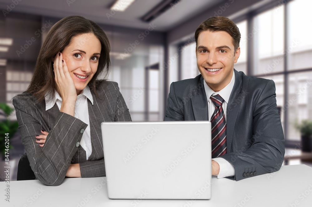 Smiling financial advisor consulting client at meeting Smiling financial advisor consulting client at meeting