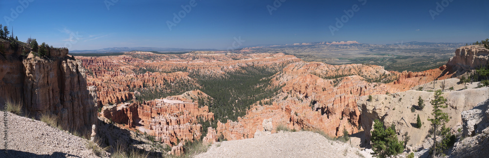 Bryce Canyon panorama from Rim trail, giant red rock hoodoos rows in natural amphitheater Bryce Canyon panorama from Rim trail, giant red rock hoodoos rows in natural amphitheater